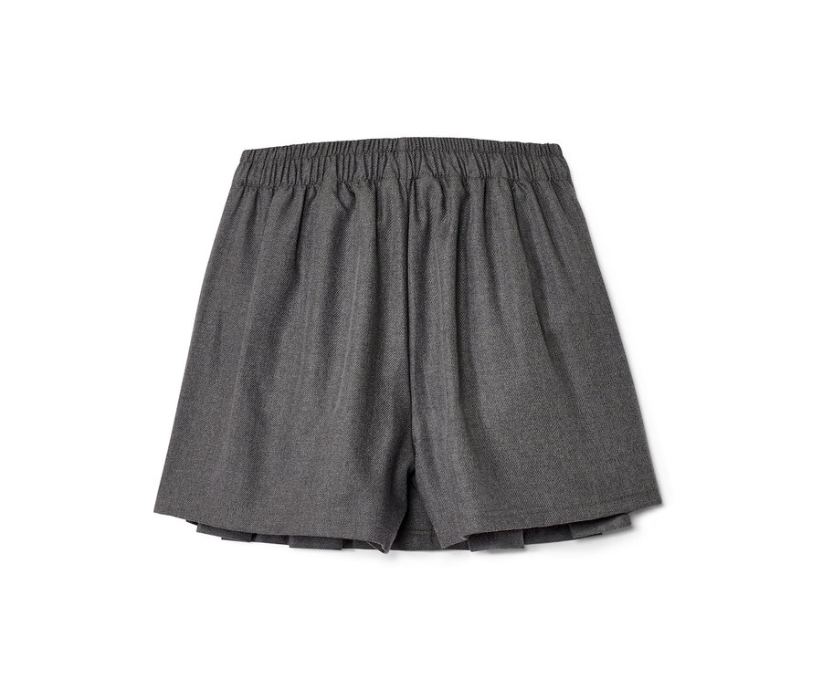 Ein grauer Kinder-Hosenrock auf einem weißen Hintergrund.