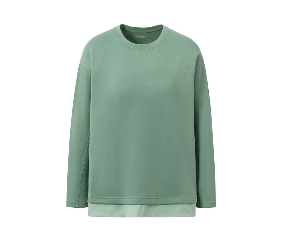 Ein grünes Oversized Fitness-Longsleeve auf einem weißen Hintergrund.