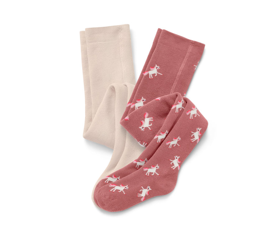 Zwei Kinder-Thermostrumpfhosen, eine cremefarbene und eine rosa mit Einhorn-Print.