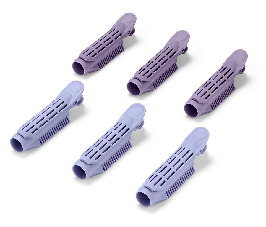 Sechs lila Haarwickler auf weißem Hintergrund.