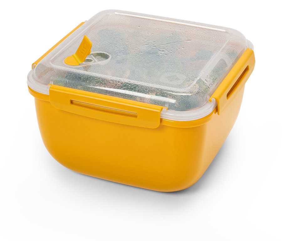 Gelbe Lunchbox mit transparentem Deckel gefüllt mit Gemüse.