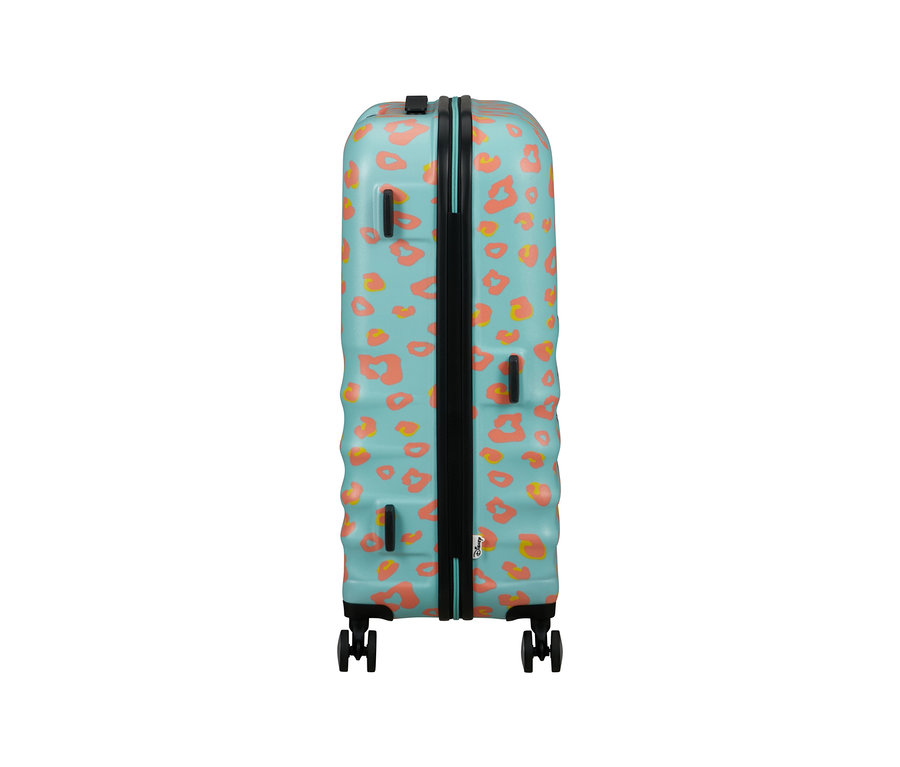Blauer American Tourister Wavebreaker »Minnie Mouse«, mittelgroß, mit orangefarbenen Flecken.