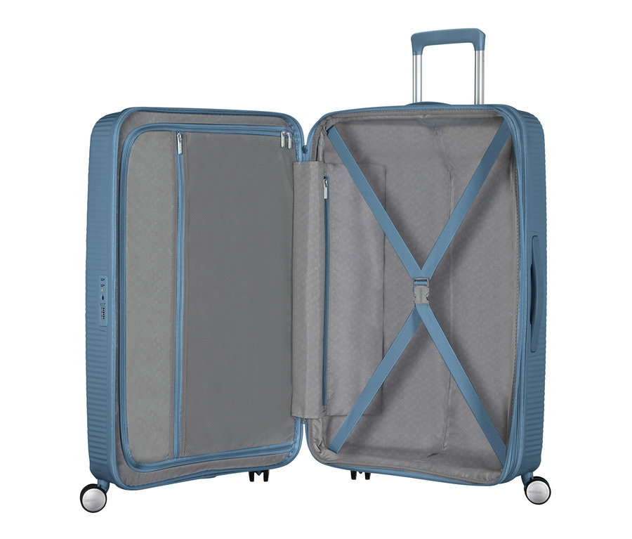 Geöffneter American Tourister Hartschalen-Koffer »Soundbox« Spinner, groß, stone blue.