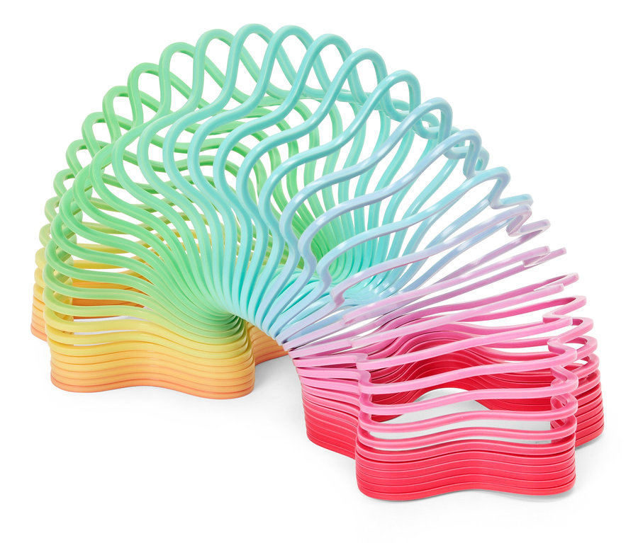 Ein spiralförmiges Spielzeug, das von Gelb über Grün und Blau bis hin zu Rosa und Rot verläuft.