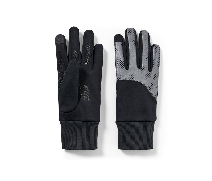 Zwei Windprotection-Handschuhe mit Reflektorbesatz liegen flach.