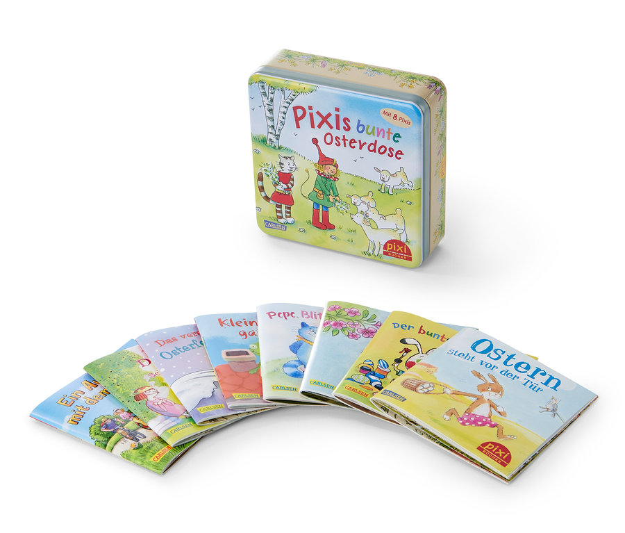 Eine Pixis bunte Osterdose Blechdose und mehrere Pixi-Bücher in einer Reihe angeordnet.