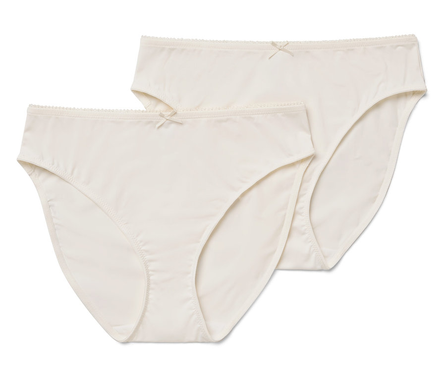 Zwei cremefarbene Damenslips mit Schleife.