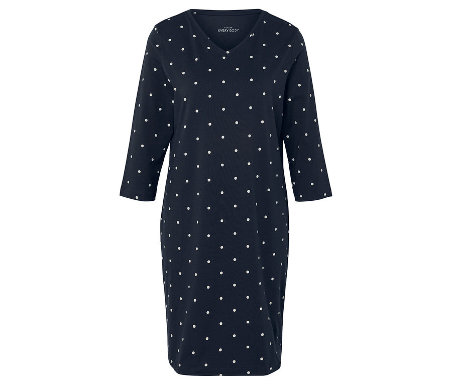 Blaues Kleid mit weißen Punkten und 3/4-Ärmeln.