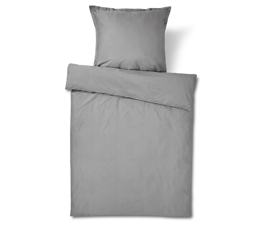 Graue Bettwäsche mit Kissen- und Deckenbezug.