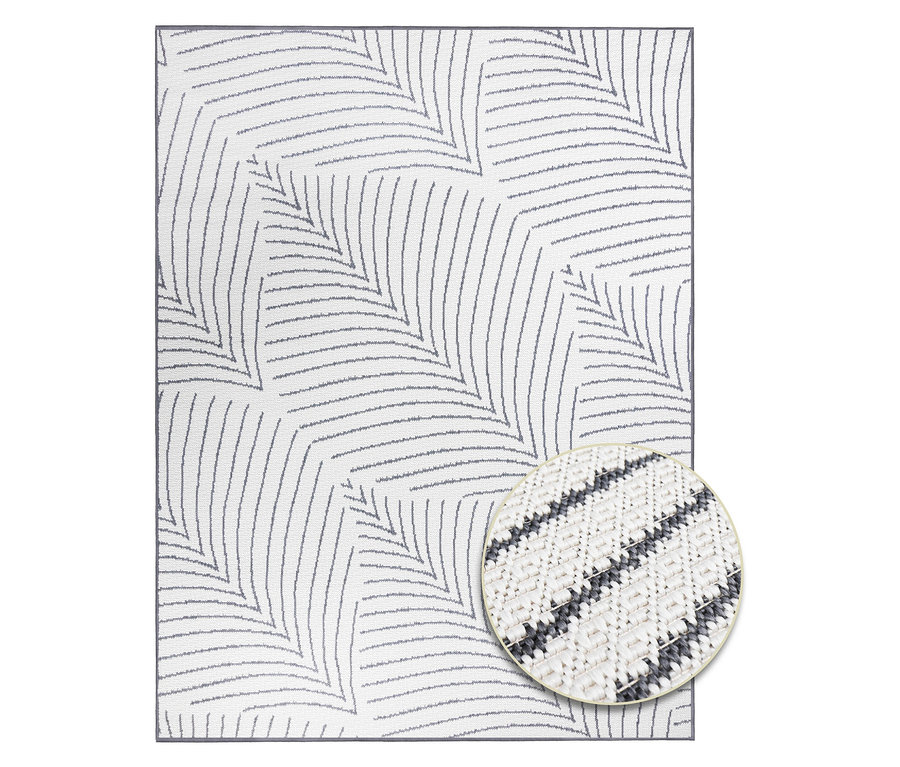 Ein weißer Teppich mit einem grauen Blattmuster. Nahaufnahme der Textur in einem Kreis.