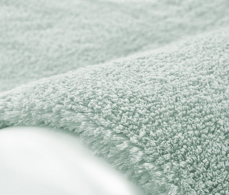 Nahaufnahme eines hellgrünen Kayoom Hochflorteppichs »Bali 110«.