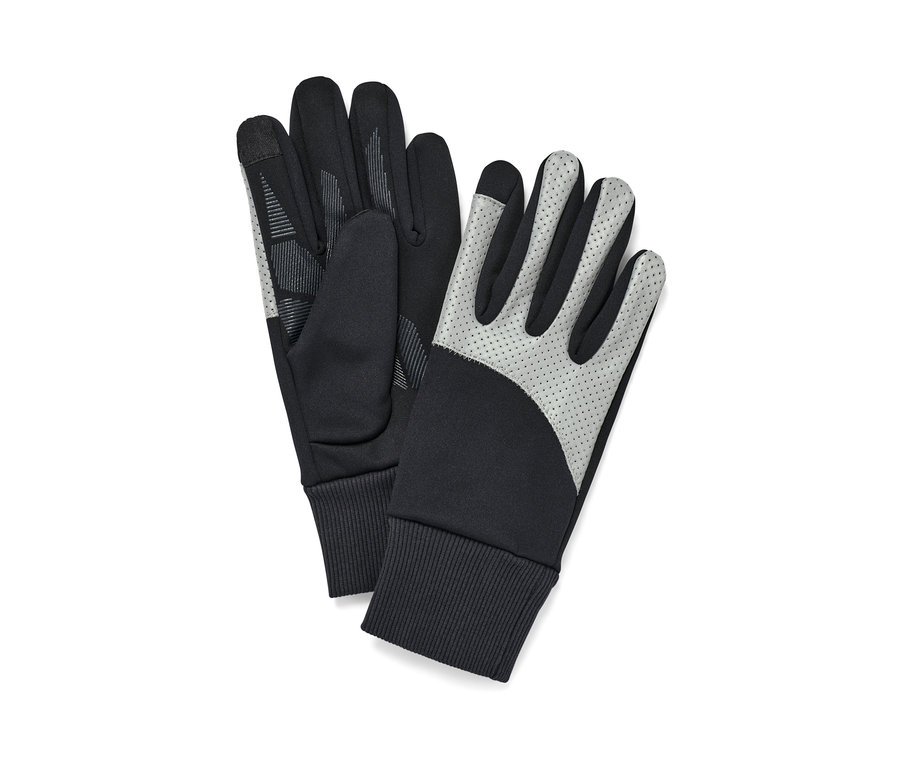 Zwei schwarze Windprotection-Handschuhe mit Reflektorbesatz liegen nebeneinander.