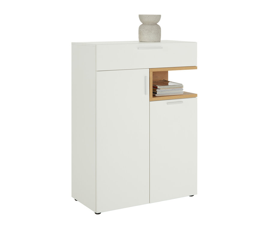 Weißes, schmales Sideboard »Nonza« mit Türen, Schublade und offenem Regal mit Zeitschriften.