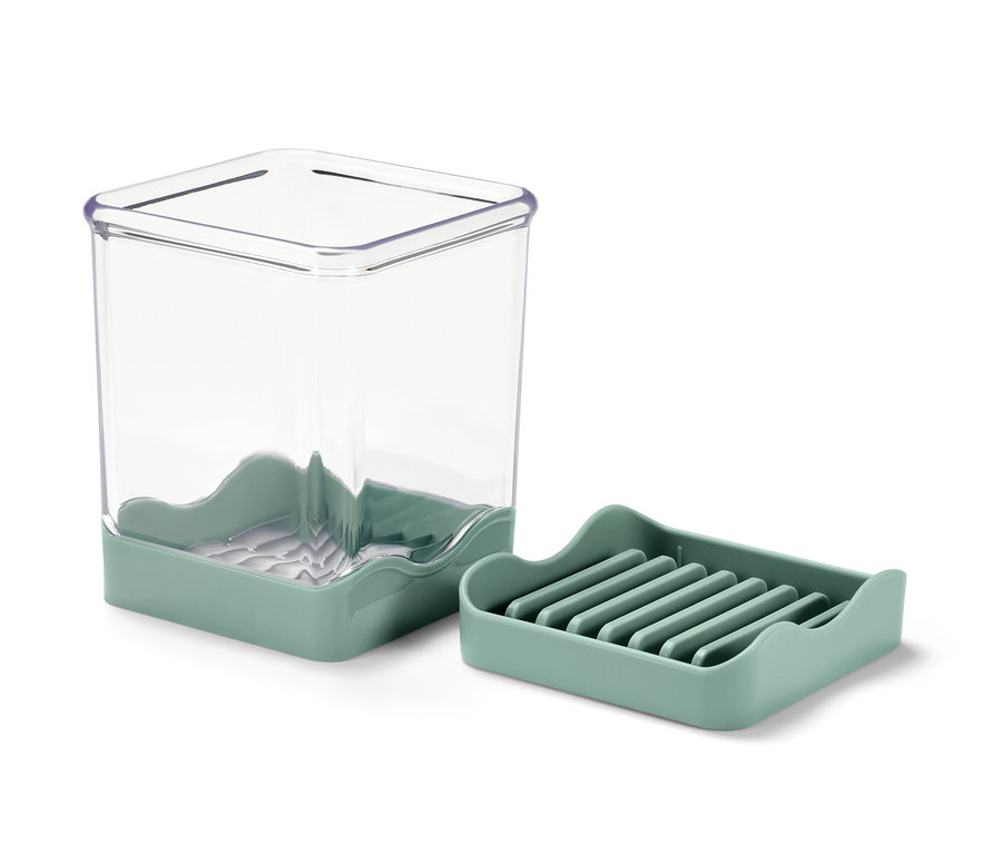 Obst-und Gemüseschneider mit grünem Sockel und transparentem Behälter.