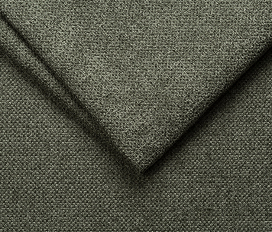 Nahaufnahme eines grünen, strukturierten Stoffes.