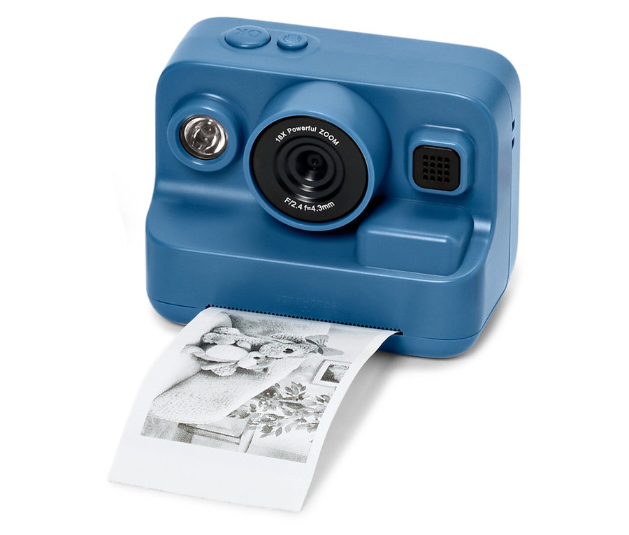 Blaue Kamera mit Drucker, die ein Foto ausdruckt.