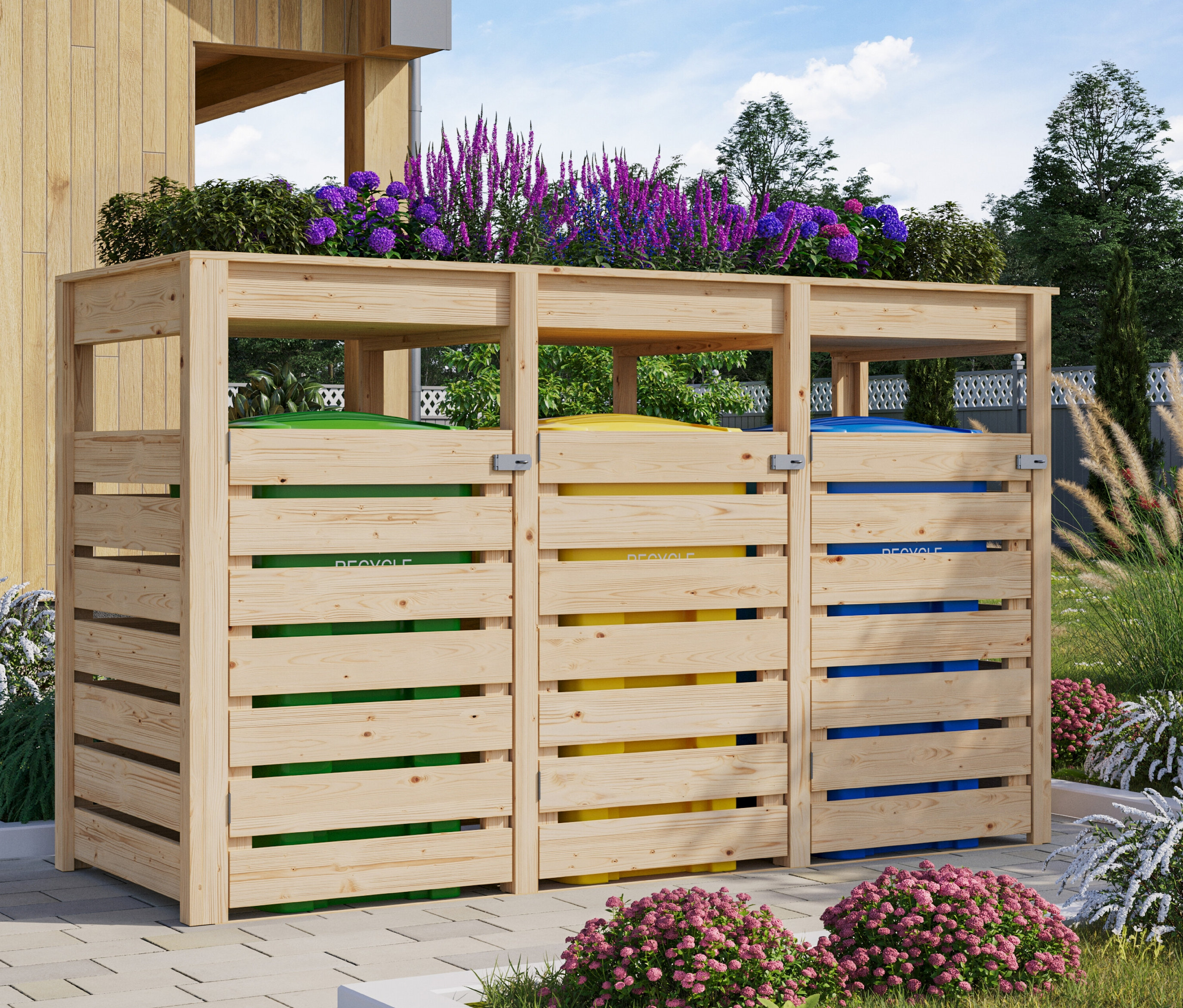 Karibu Mülltonnenbox für 3 Tonnen mit Pflanzdach (3 x 240l) im Garten mit drei Mülltonnen in grün, gelb und blau.