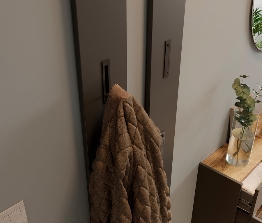 Eine braune Jacke hängt an einem graphitfarbenen Garderobenpaneel »Ameca« neben einem breiten graphitfarbenen Mehrzweckschrank »Ameca«.