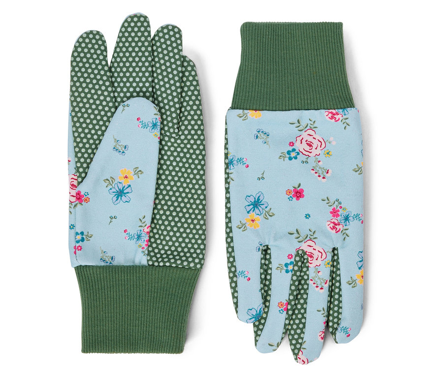 Zwei Garten-Handschuhe mit Blumenmuster und grünen Bündchen liegen nebeneinander.