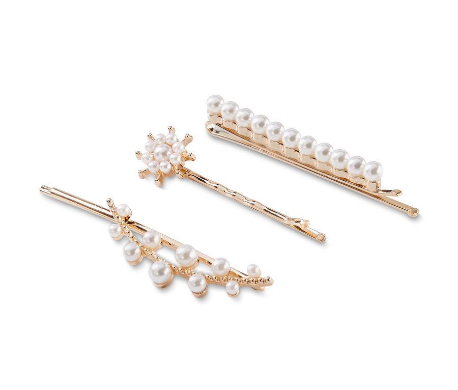 3er-Set goldene Haarspangen mit Perlen auf weißem Hintergrund.