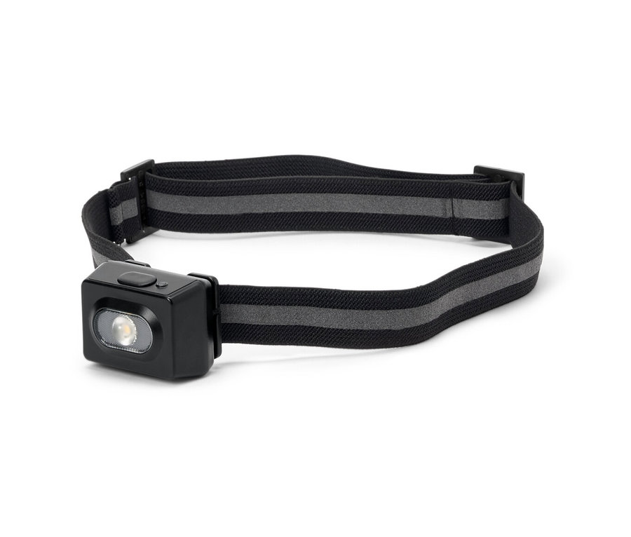 Eine Stirnlampe mit schwarzem Gehäuse und grau gestreiftem Gurt.