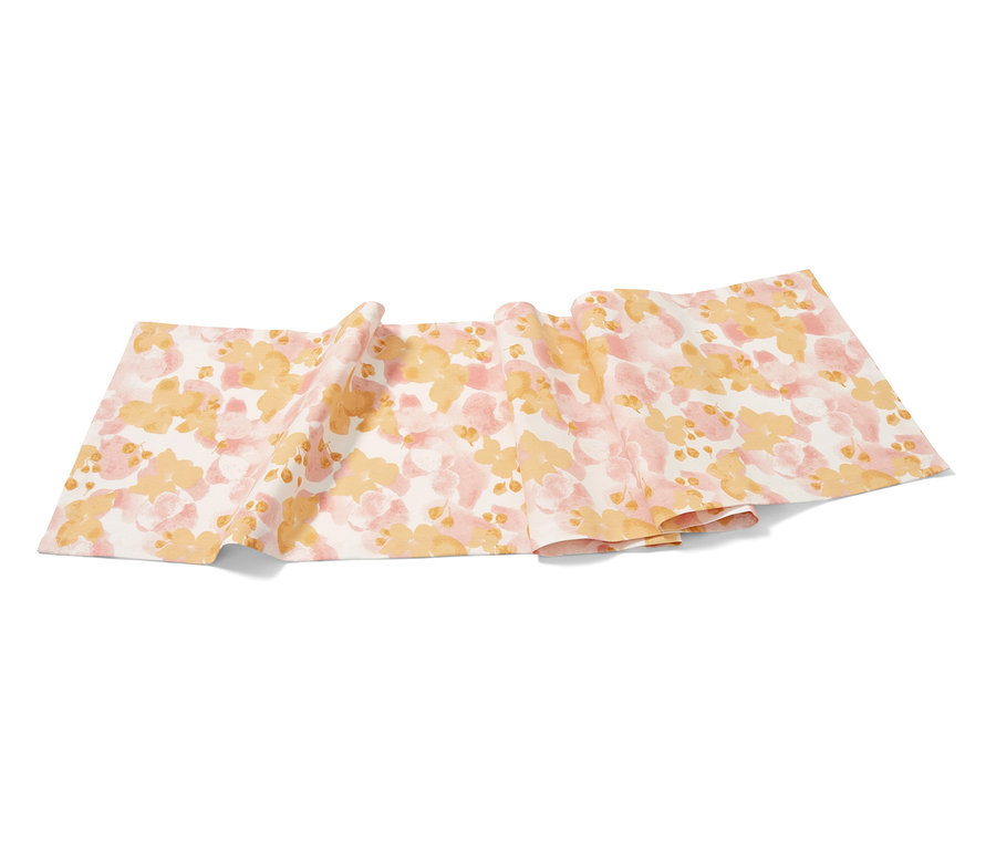 Tischläufer mit Blumenmuster in Rosa und Gelb.