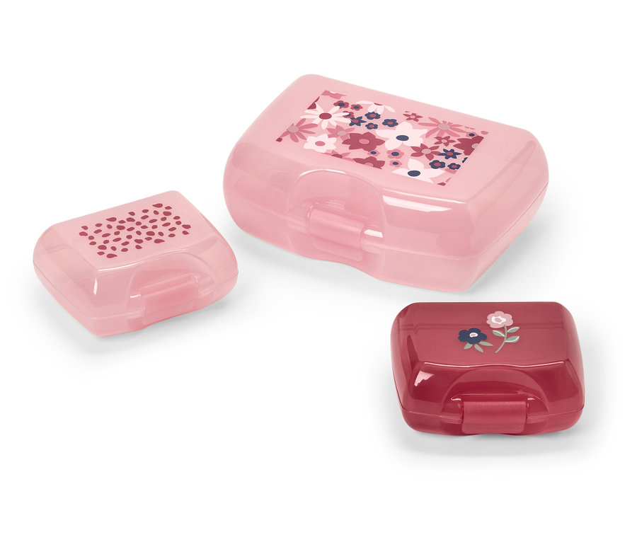 Drei verschiedenfarbige und grosse Brotboxen aus Plastik mit Blumenmuster.