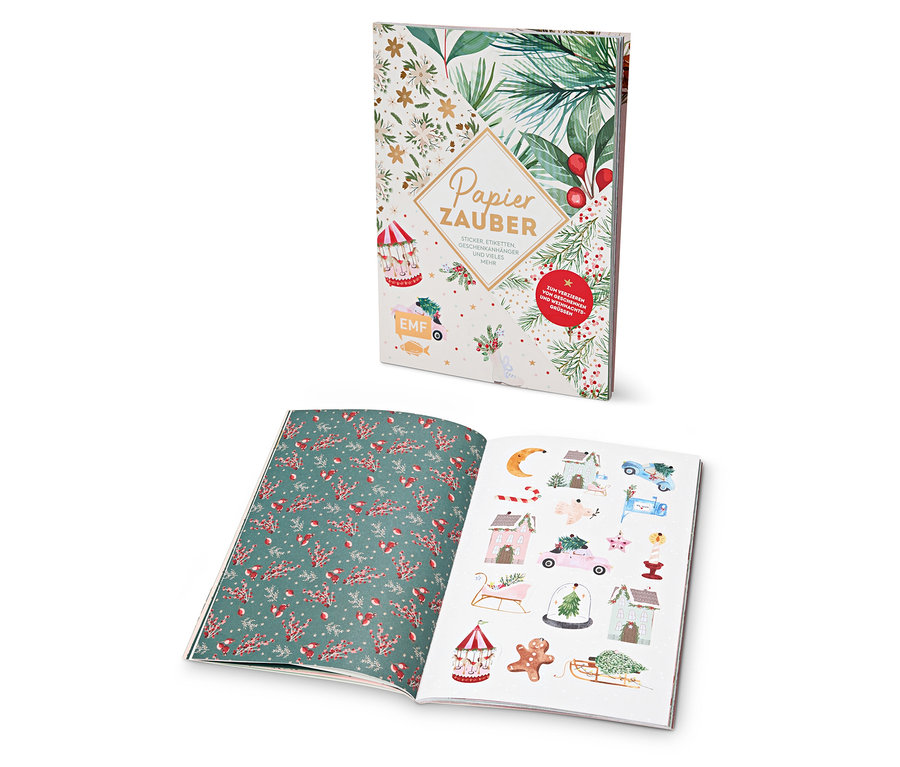 Zwei offene Notizbücher mit Weihnachtsmotiven.