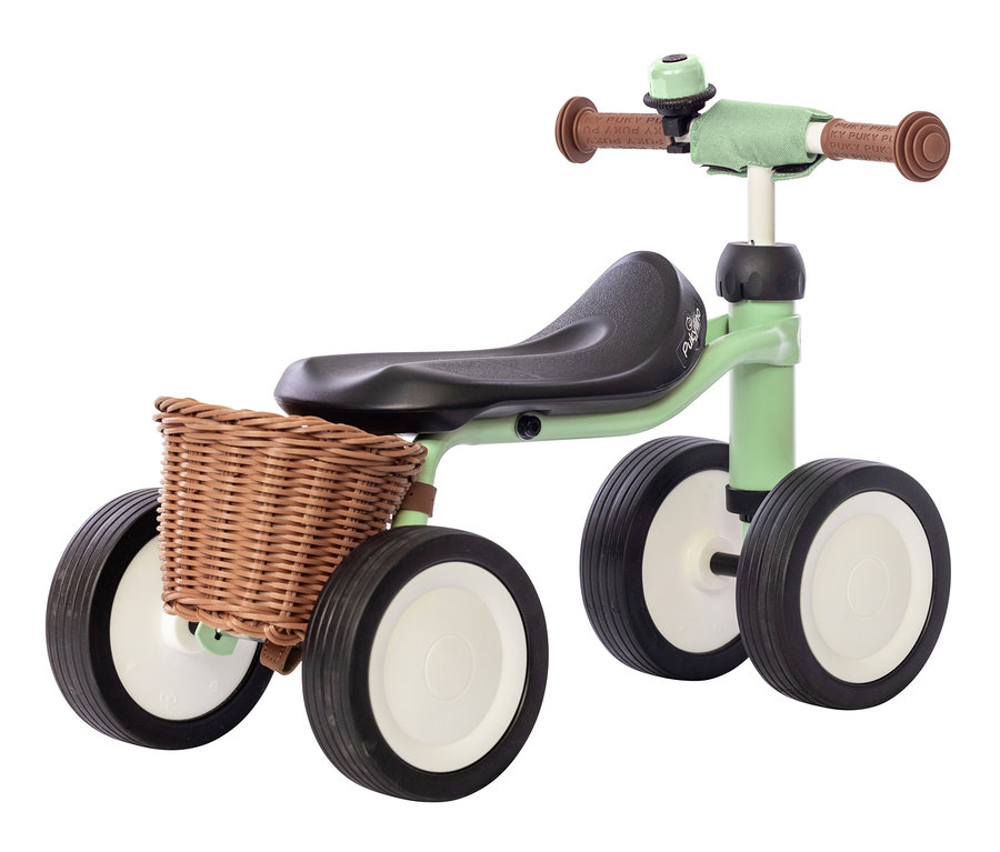 Ein hellgrünes PUKY Laufrad PUKYLINO BUNDLE mit vier Rädern und Korb.