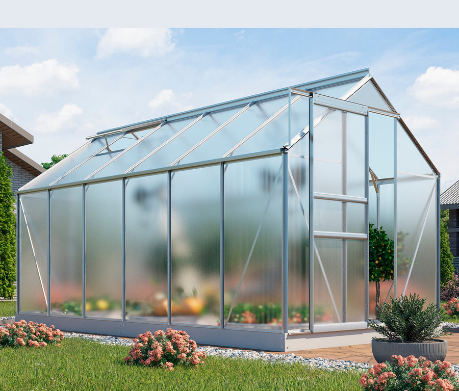 Gewächshaus »Comet« inkl. Fundament steht auf einer Wiese neben einem Haus.
