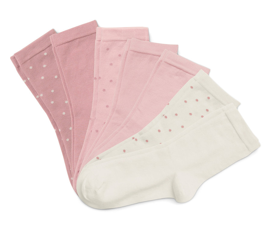 Fünf Socken liegen gefächert auf einem weißen Hintergrund. Die Socken sind rosa und weiß und haben ein Punktmuster.