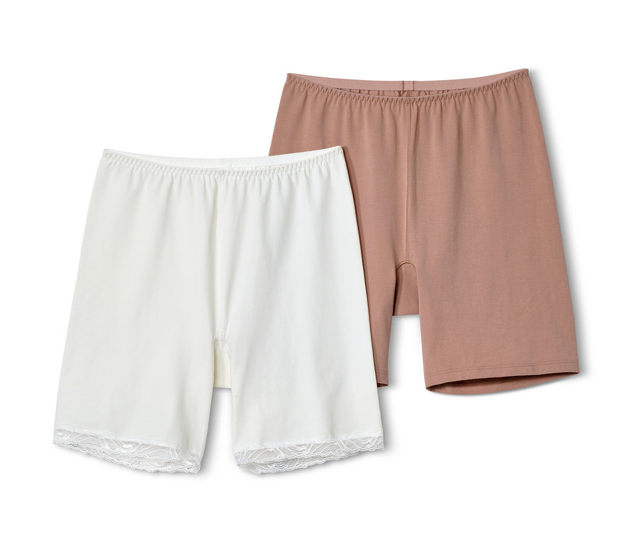Zwei Radler-Shorts, eine beige und eine weiße.