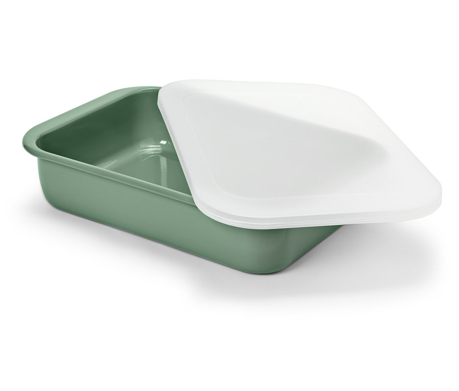 Eine grüne Schale mit einem weißen Deckel liegt auf einem weißen Hintergrund.