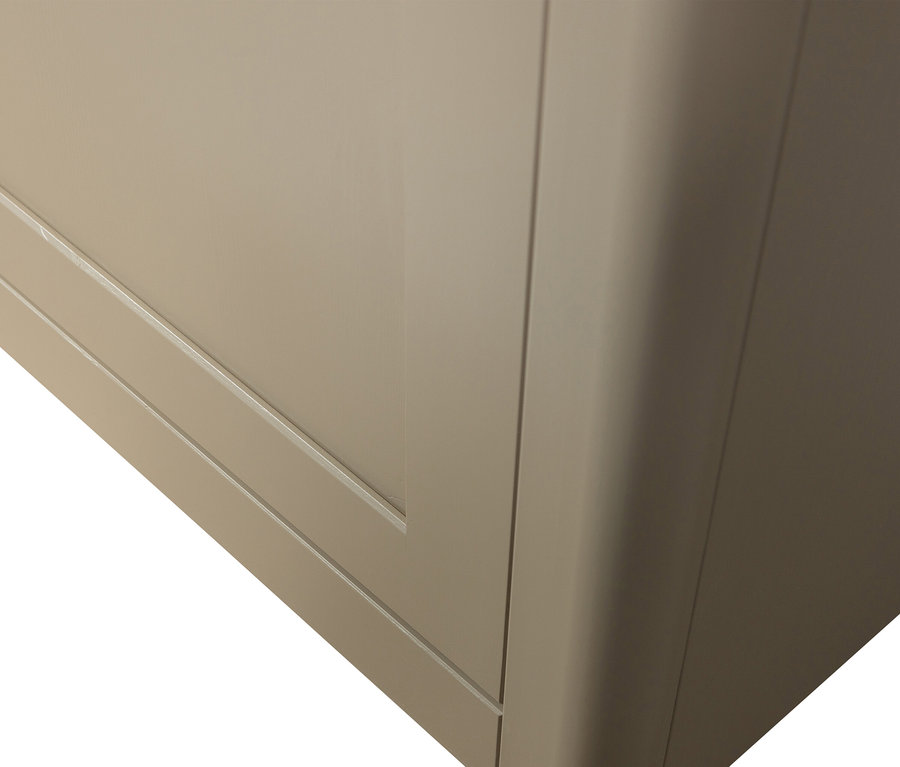 Detailansicht einer beigen Kommode mit abgerundeten Kanten.