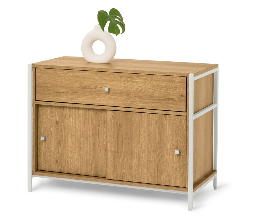 Kommode aus hellem Holz mit weißen Metallbeinen, darauf eine weiße Vase mit einem grünen Blatt.