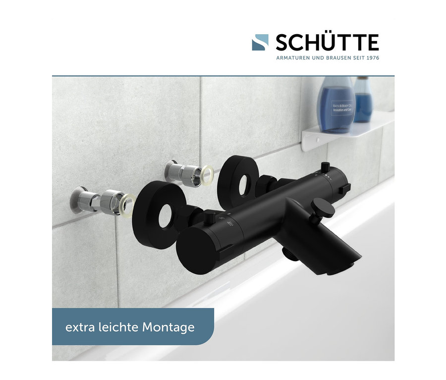 Schwarze Thermostat-Wannenfüllarmatur »London« an weißen Fliesen im Badezimmer montiert.