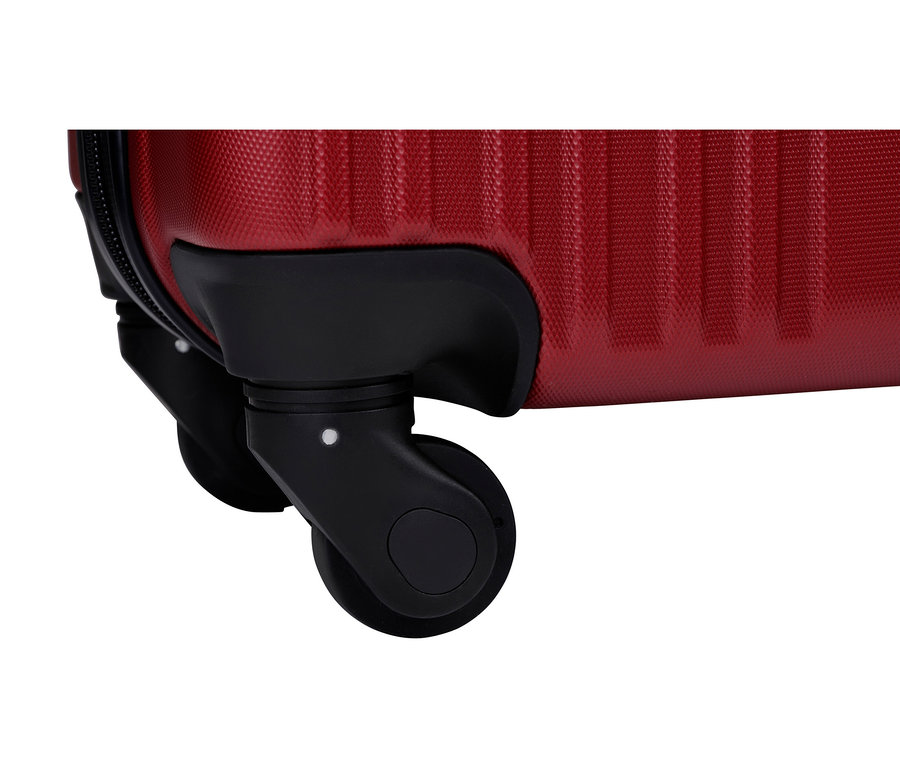 Nahaufnahme von zwei schwarzen Rollen an einem roten Koffer.