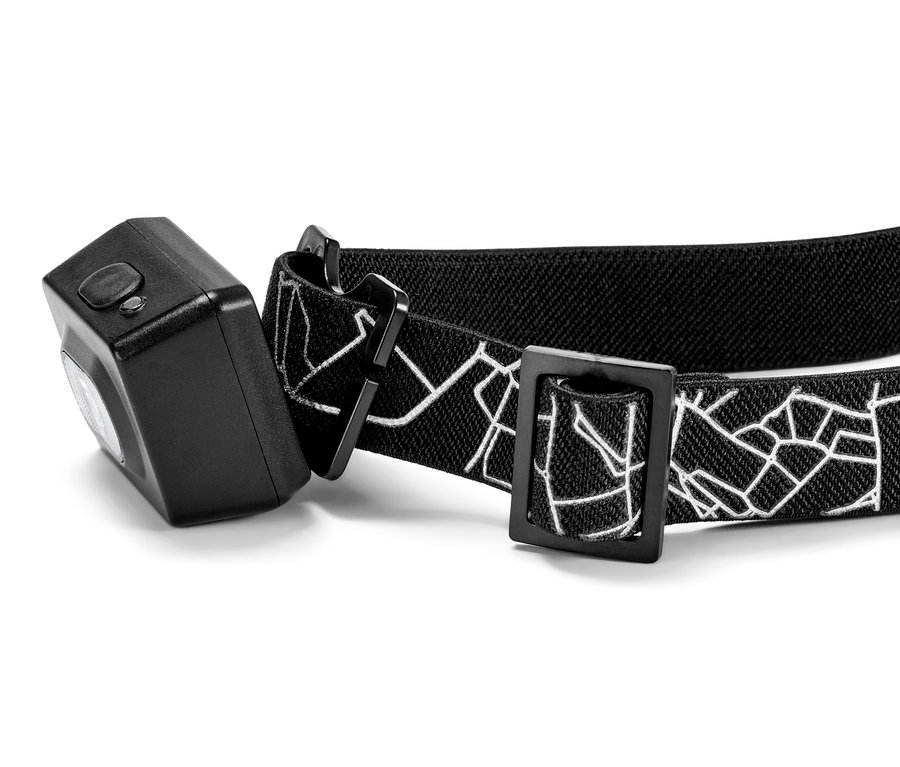 Stirnlampe mit schwarzem, elastischem Band mit weißem geometrischen Muster.