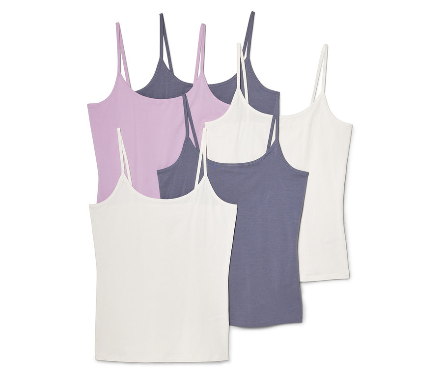 Fünf Spaghettiträger-Tops in Weiß, Lila und Graublau liegen übereinander.