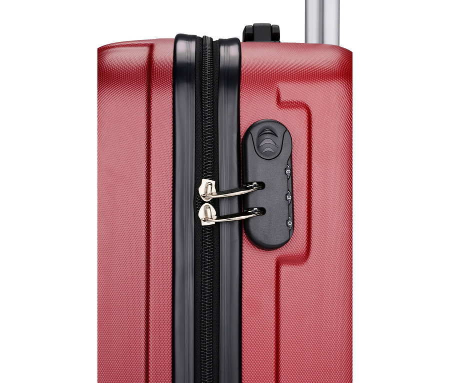 Nahaufnahme eines roten Koffers mit schwarzem Reißverschluss und Zahlenschloss.