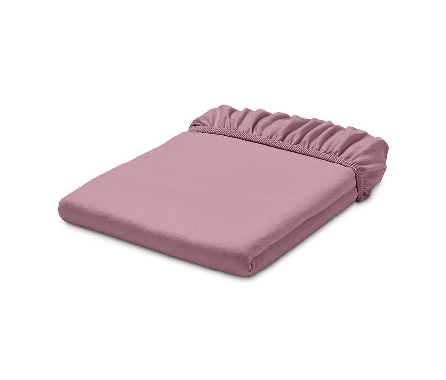 Gefaltetes, roséfarbenes Jersey-Spannbettlaken.