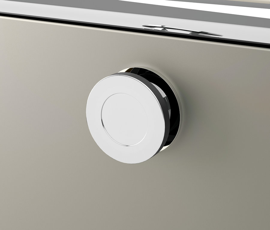 Detail einer Schublade mit einem silbernen, runden Griff.