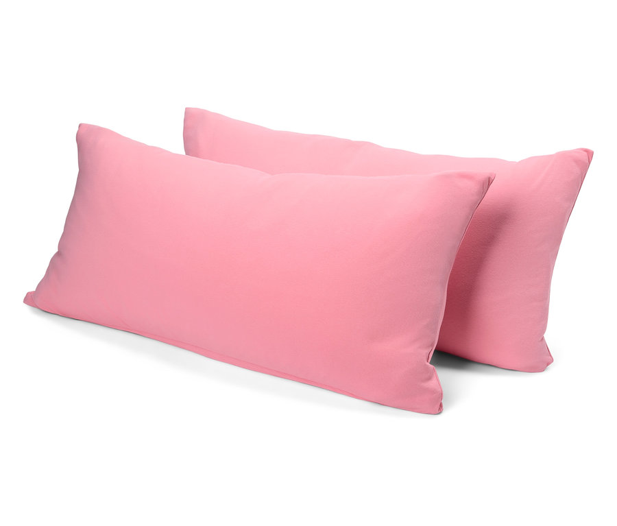 Zwei rosa Kissen liegen übereinander.