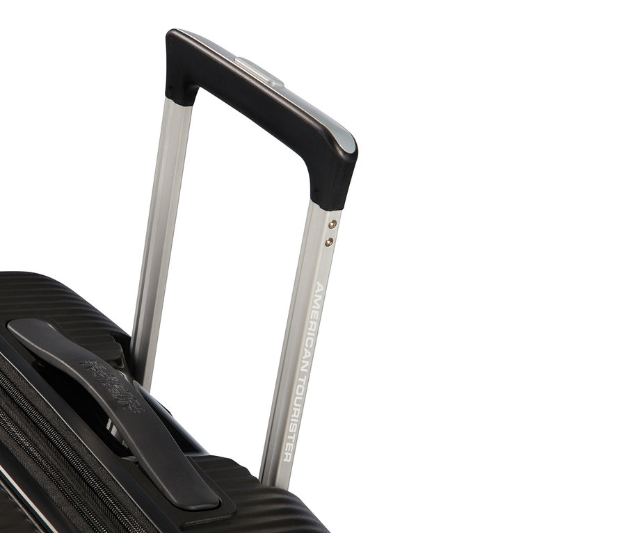 Detailansicht eines schwarzen American Tourister Hartschalen-Koffers »Soundbox« Spinner mit Teleskopgriff.