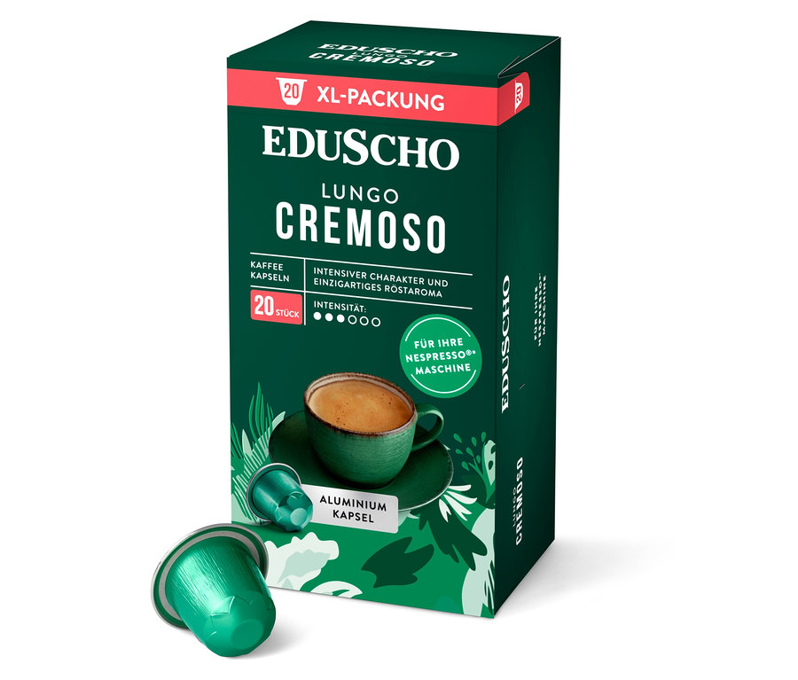 Eine grüne Packung EDUSCHO Lungo Cremoso Kaffeekapseln steht neben einer einzelnen Kapsel.