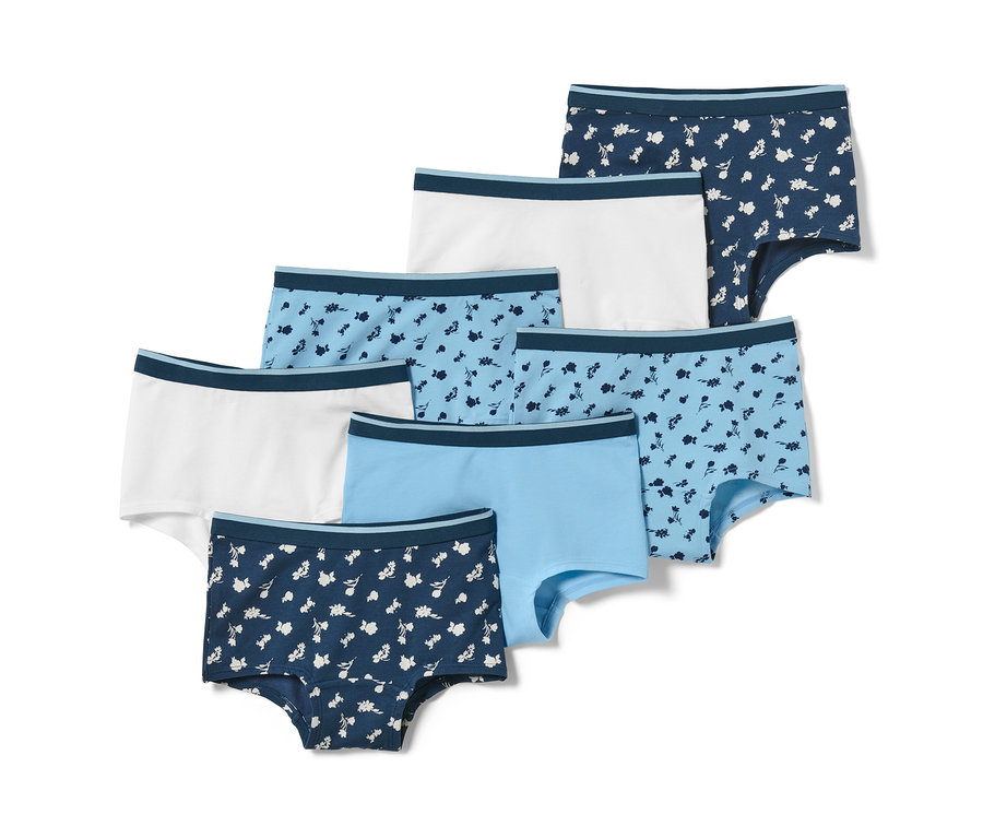 Sieben blaue Mädchen-Pantys. Die Pantys sind mit Blumenmuster oder einfarbig.