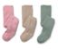 Zwei Kinderstrumpfhosen in Rosa mit Herzmuster und zwei in Beige und Grün liegen nebeneinander.