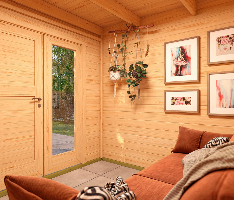 Innenansicht eines Holzgartenhauses mit braunem Sofa, Bildern und Blumen. Weka Design-Gerätehaus »Pure Garden«, 19 mm Wandstärke