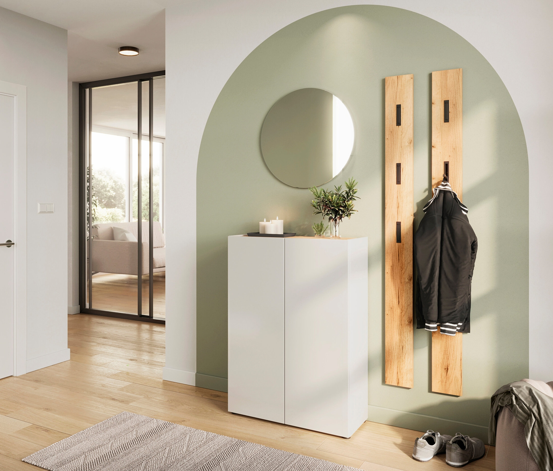 Eingangsbereich mit weißem Schuhschrank »Alviano«, rundem Spiegel und hölzerner Garderobe.