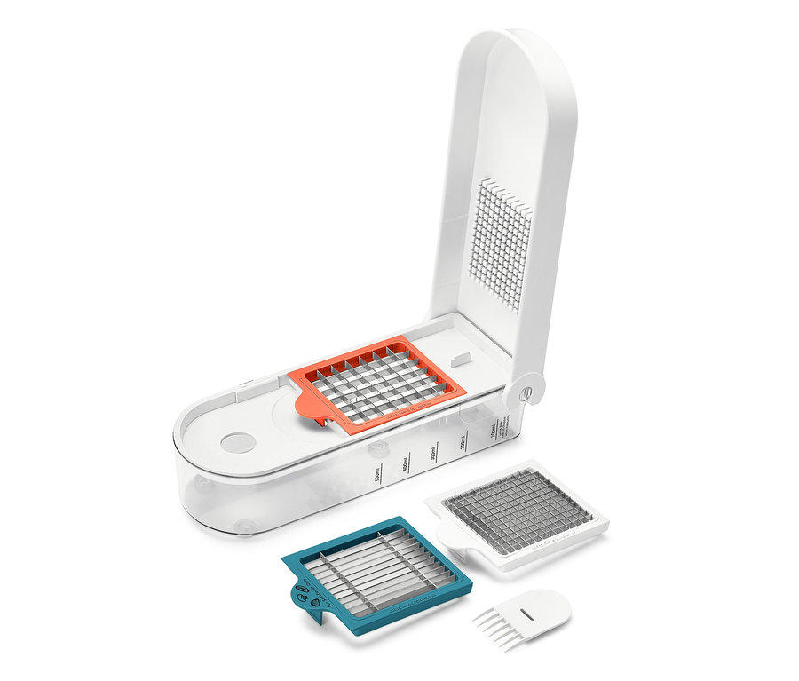 Weißer Obst- und Gemüseschneider mit verschiedenen Aufsätzen.